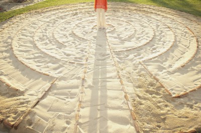 Person standing in the middle of a meditation labyrinth