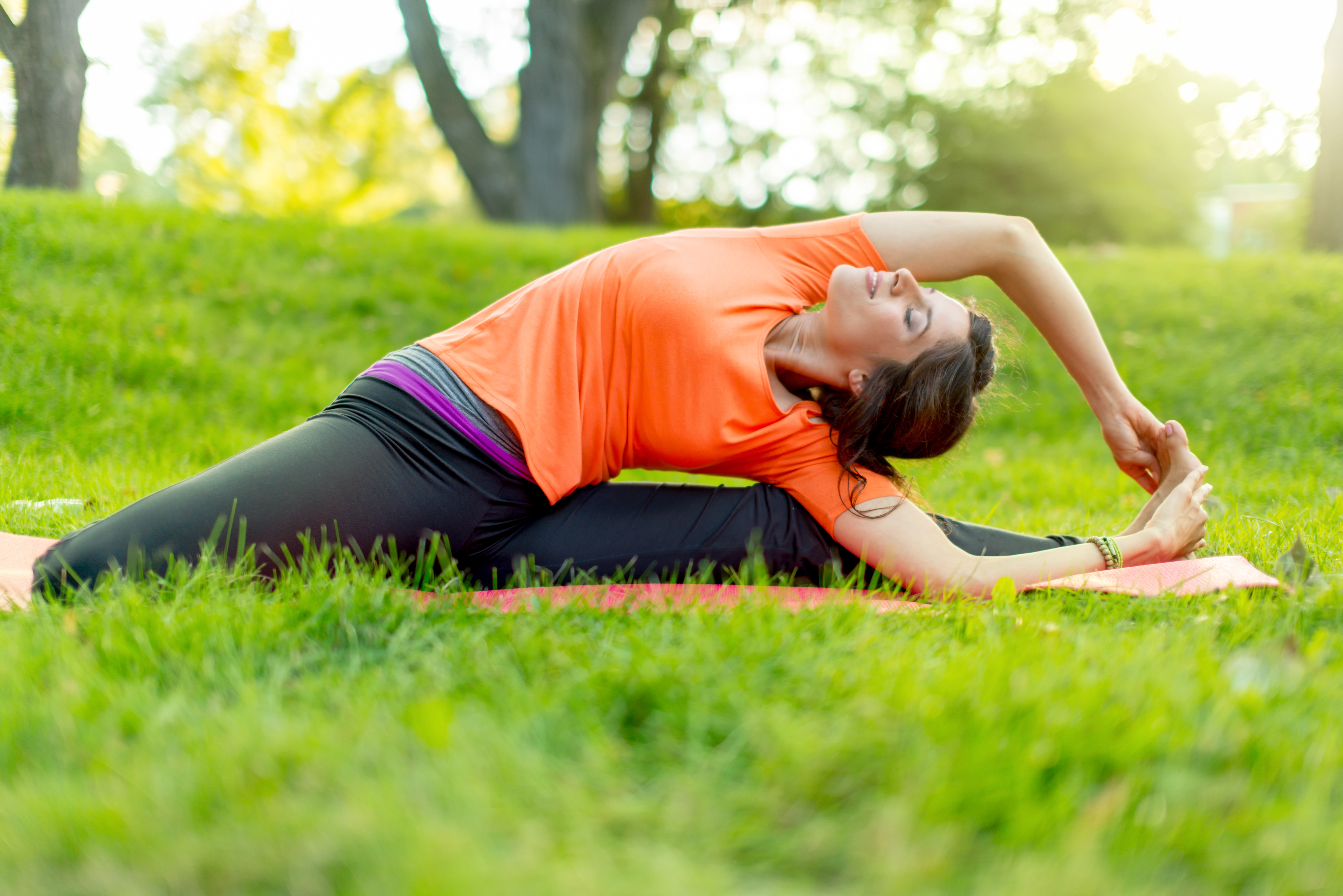 girl meditating and doing yoga at sunsets